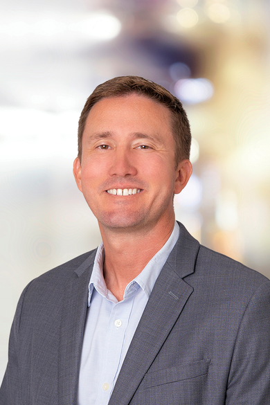 Portrait of Corey Mahoney, REALTOR® | ABR® | RSPS | NRLUX.